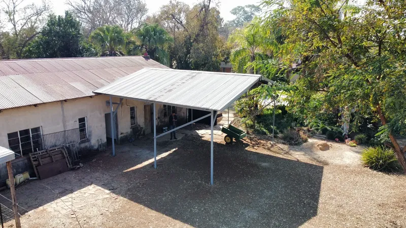Aerial View of Custom Steel Patio Roof (Afdak)